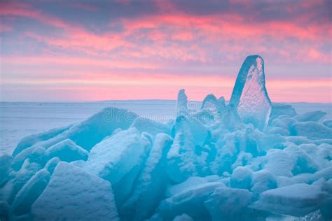 Blue Transparent Ice On Baikal Lake At Sunrise Pink Clouds And Blue