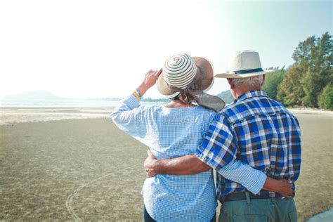 Elderly Asian Couples Hugging Each Other At The Beach Stock Image Image Of Blue Retired