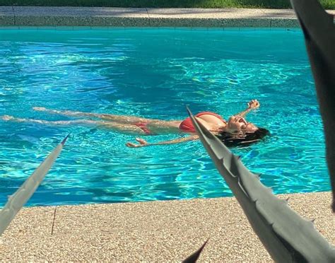 Salma Hayek Shared An Instagram Photo Of Her Rocking A Deep Red Bathing Suit At The Edge Of Her