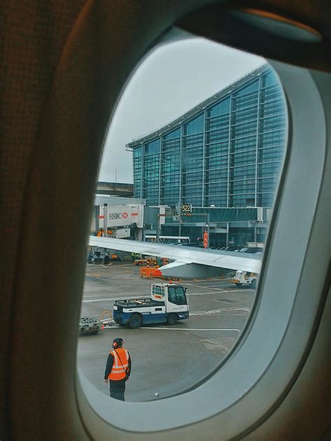 Airport Through Window Of Plane · Free Stock Photo