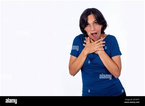 Black Haired Woman With Her Arms Crossed On Her Chest And A Shocked
