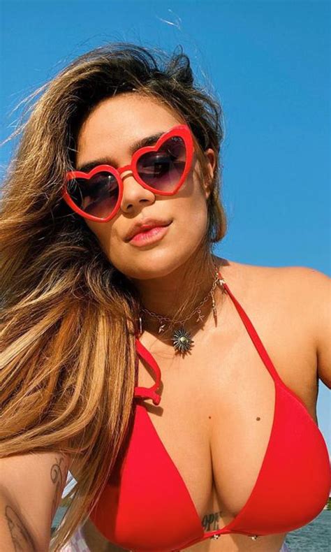 Karol G Enjoys Sun And Shows Off Her Curves In A Red Bikini