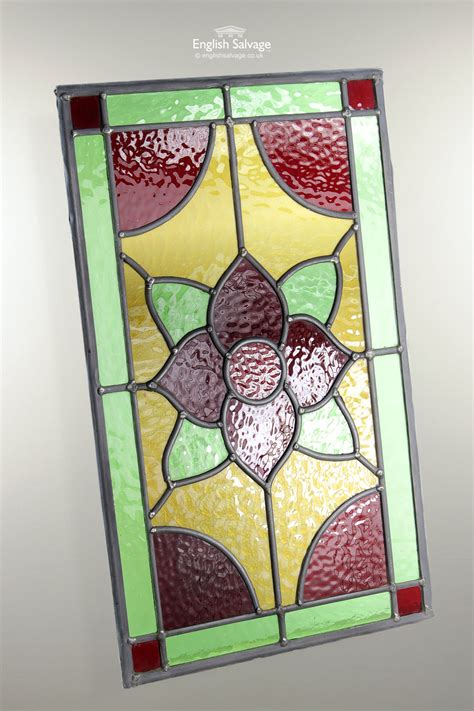 By having pigments baked onto its surface or by having various metallic oxides fused into it. Reclaimed Small Stained Glass Leaded Panels