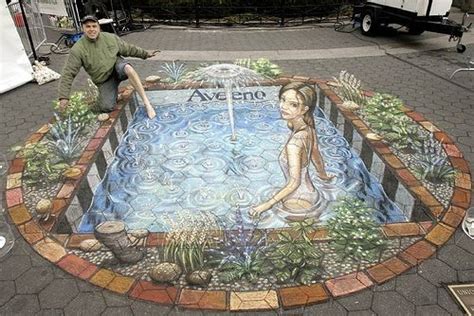 A Man Sitting On The Edge Of A Pool With A Woman In It And Plants
