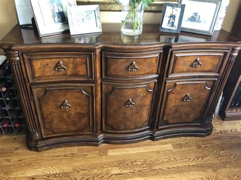 Four seagrass baskets add a casually quaint touch. Ashley furniture buffet for Sale in Baltimore, MD - OfferUp