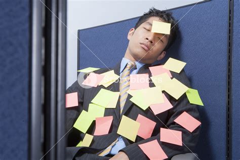 Businessman Asleep At Desk With Notes Royalty Free Stock Image