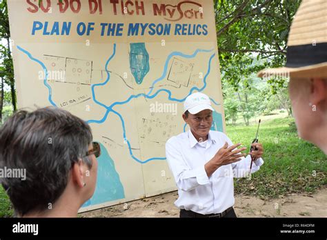 My Son Vietnam Tourists Listen To A Local Tour Guide Beside A Map