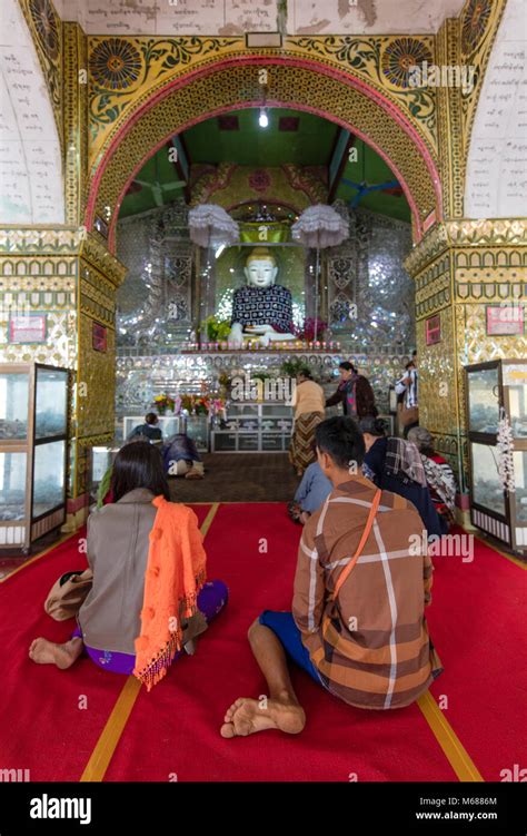 Burmese People Praying In Front Of The Buddha Inside The Sutaungpyei