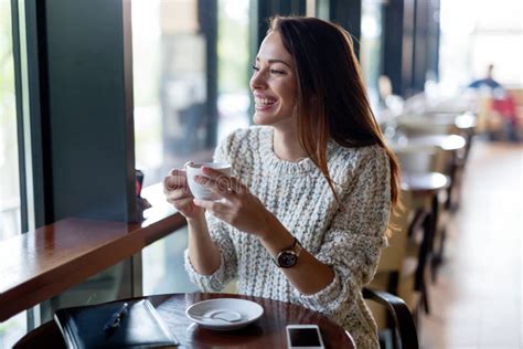 Young Beautiful Woman Drinking Coffee In Restaurant Stock Photo Image