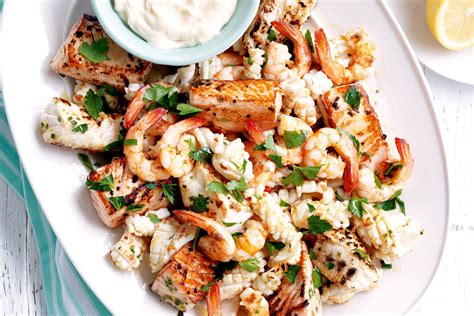How good is an when we talk australian christmas feasting, does it get any more 'strayan than a table heaving with seafood? Seafood platter with aioli | Recipe | Seafood dinner recipes, Seafood platter, Seafood recipes