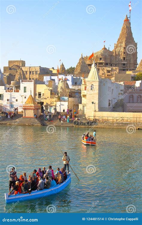 Dwarkadhish Temple And Transportation Of Pilgrims By Boat On The Bank On River Gomti Editorial