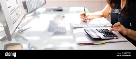 Chartered Accountant Hand Calculating Tax And Salary Stock Photo Alamy