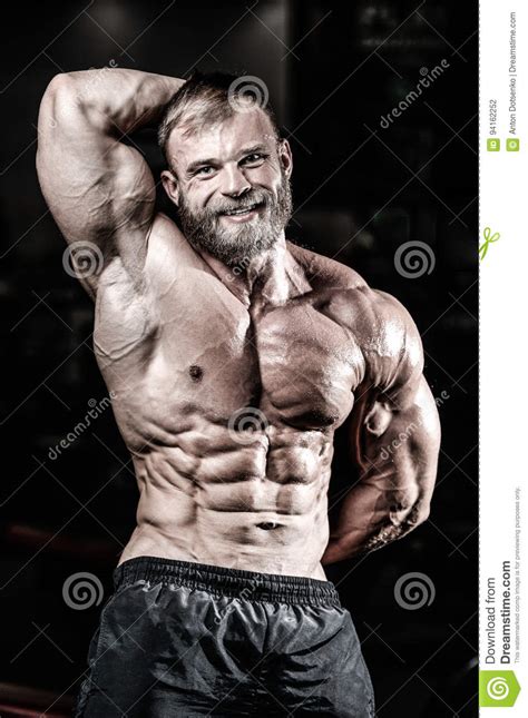 Handsome Fit Caucasian Muscular Man Flexing His Muscles In Gym Stock