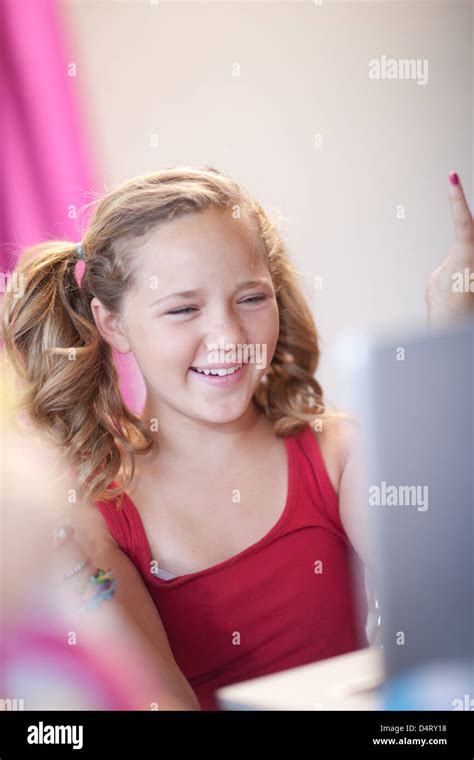 Smiling Girl Using Laptop Stock Photo Alamy