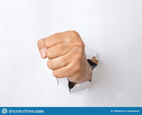 Hand Punching Through The Paper Stock Photo Image Of Breakthrough