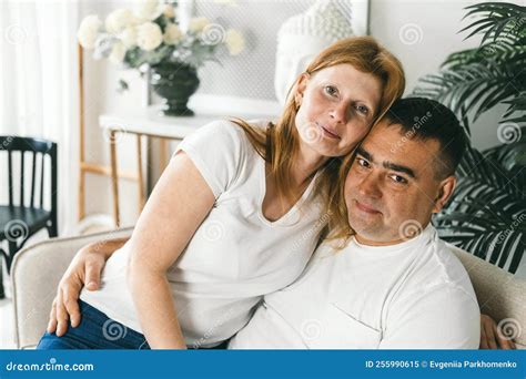 Middle Aged Married Couple Hugging On The Couch Stock Image Image Of
