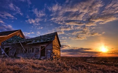 Online Crop Brown Wooden House Surrounded With Grasses During Sunset