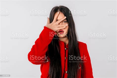 Shocked Worried Woman Hiding Face Behind Hands Peeking Through Fingers