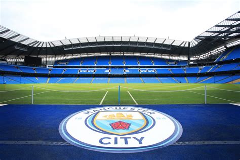 Get the latest man city news, injury updates, fixtures, player signings, match highlights & much more! Manchester City Football - Etihad Stadium Pitch and Emblem ...