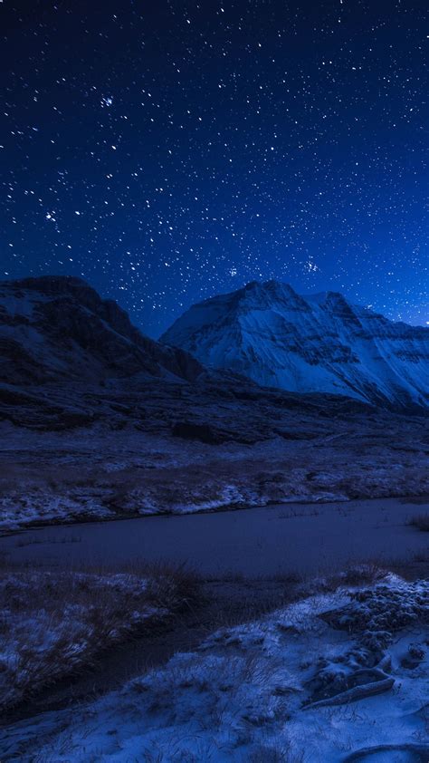 Starry Night Sky Above The Snowy Mountains Backiee