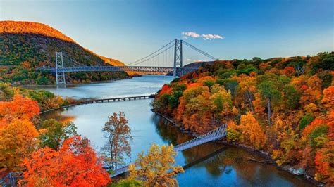 Aerial View Of Bridge And Green Yellow Red Leafed Autumn Trees Forest