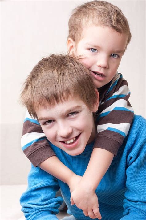 Portrait Of Two Brothers Stock Photo Image Of Look Sofa 17791800