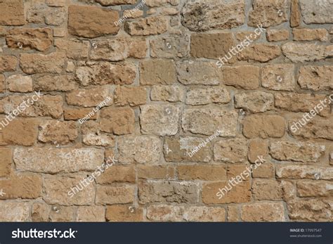 Rough Decorative Stone Wall For A Background Stock Photo