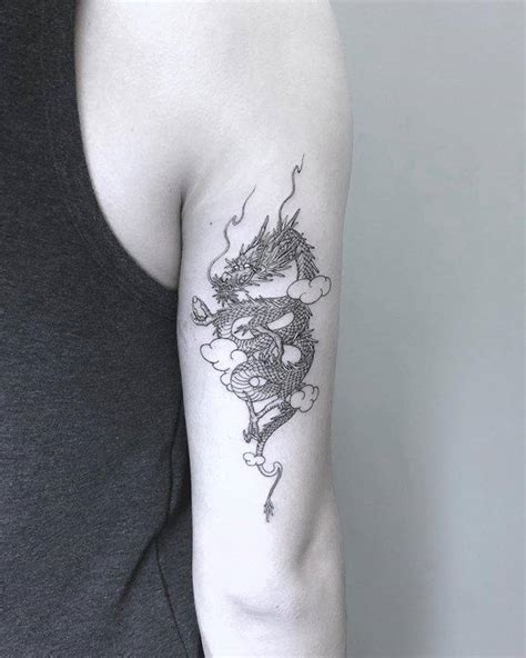 Chinese Dragon Tattoo On The Back Of The Right Arm