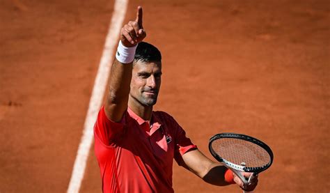 novak djokovic secures last eight place for 14th straight french open