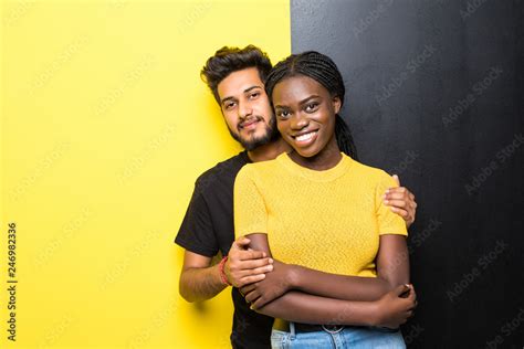 Babe Happy Mixed Race Couple Indian Man And African Woman Hug Isolated On Yellow Black