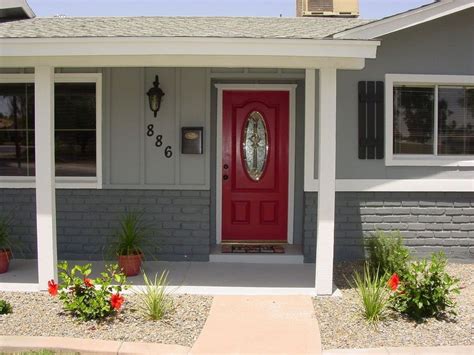 Best trim colors for brick | catherine arensberg. Grey house, dark grey brick, red door, black house numbers ...