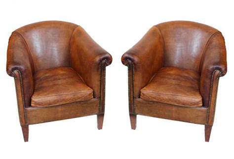 Vintage leather armchairs in the dim light. Vintage Leather Club Chairs, Pair | Omero Home