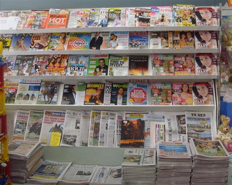 Magazines And Newspapers Working Together In A Newsagency Australian