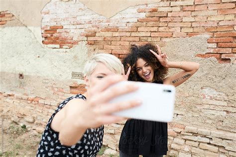Two Friends Selfie By Stocksy Contributor Guille Faingold Stocksy