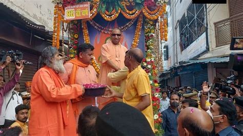 With Sunglasses And Toy Bulldozer Yogi Adityanath Celebrates Holi In Gorakhpur See Pics India