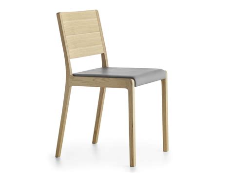 You can decide to look for wooden dining chairs that are already cushioned. Solid wood chair, padded seat | IDFdesign