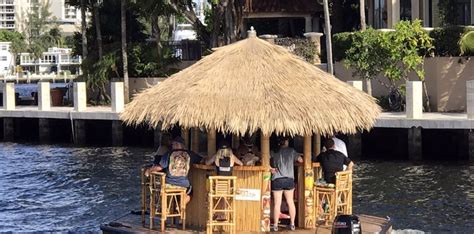 a trip on the floating tiki bar cruisin tikis in florida is the ultimate summer adventure
