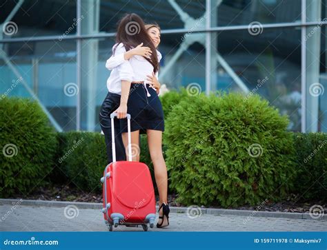 friend welcome back by embracing airport hall international missing hug and greeting at arrival