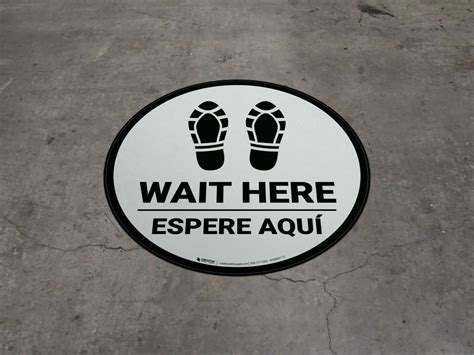 Wait Here Espere Aqui Shoe Prints Bilingual Spanish Circular Floor Sign