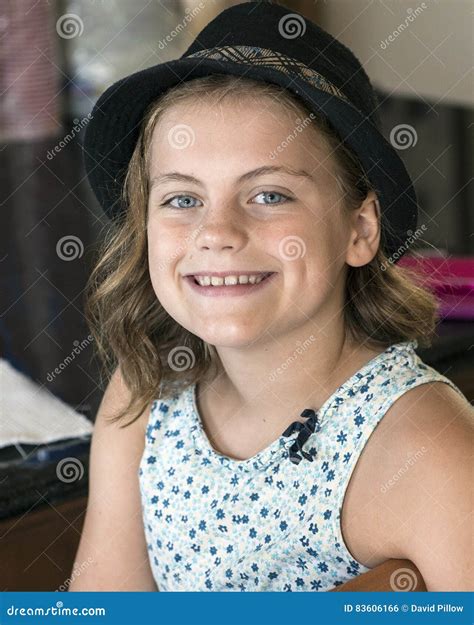 Smiling Cute Ten Year Old Girl Sitting Stock Photo Image Of Closeup