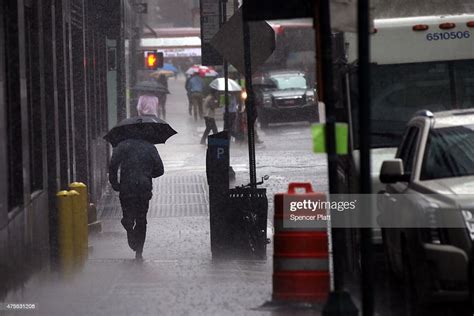 A Man Runs For Cover During A Heavy Rain Storm In Manhattan On June News Photo Getty Images