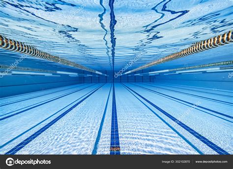 1l = 0.001m3 so 2,500 x 1000 = 2,500,000l) 660,430 gallons of water. Olympic Swimming pool under water background. — Stock ...