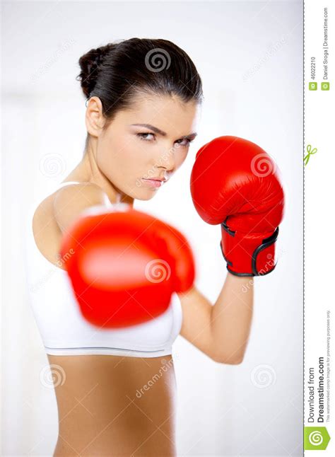 Determined Woman Wearing Red Boxing Gloves Stock Photo