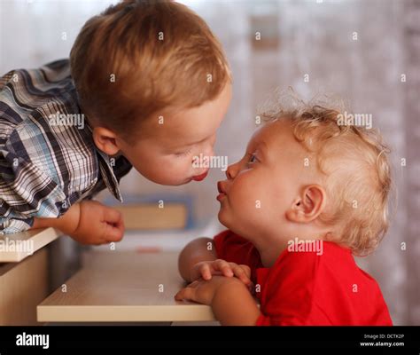 Cute Siblings Two Little Brothers Are Kissing Stock Photo Alamy