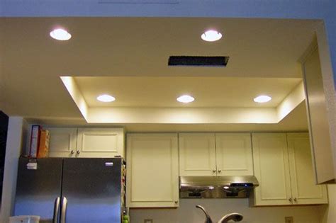 Remove the old lighting and install recessed lights inside the raised soffit ceiling. a way to fix our kitchen lighting | Ceiling remodel, Kitchen lighting remodel, Recessed lighting ...