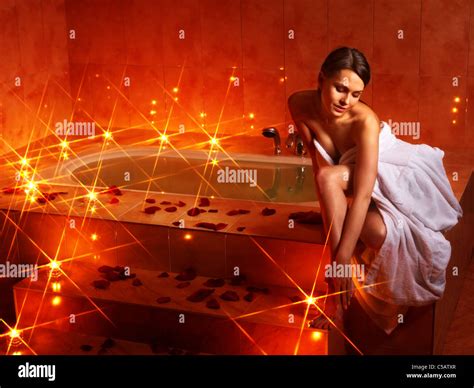 Woman Relaxing In Bath With Rose Petal Stock Photo Alamy