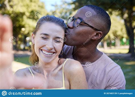 Love Kiss And Selfie With Interracial Couple At Park For Relax Social Media And Romantic Date