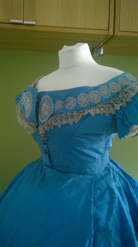 Components of a traditional victorian attire for women. A magnificent light blue silk 1860s crinoline two piece ...