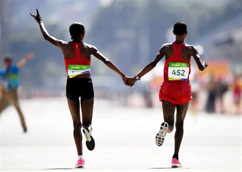 In The Womens Marathon Kenyan Wins After Dodging A Protester Near The