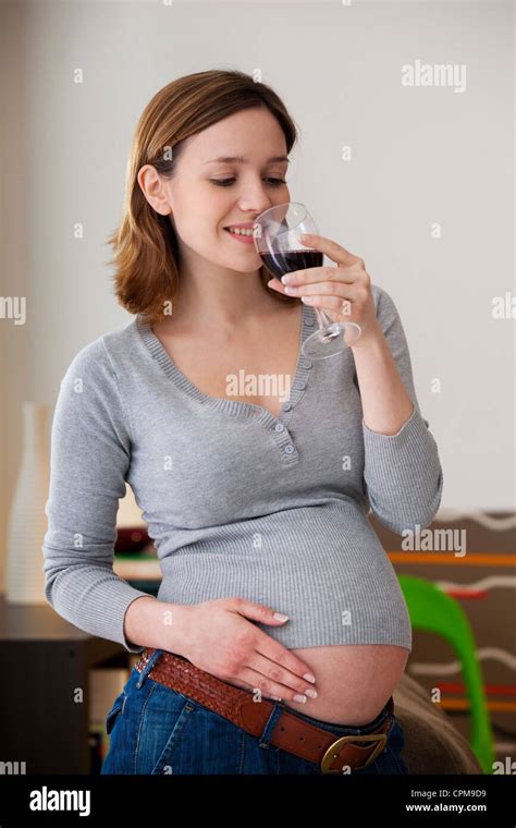Pregnant Woman Drinking Stock Photo Alamy